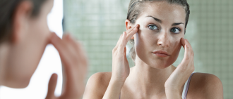 woman looking in mirror