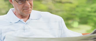 man reading in park