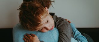 Mom comforting son