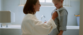 mother and daughter in bathrobes