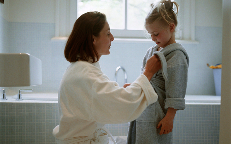 mother and daughter in bathrobes