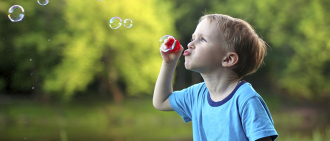 Child Blowing Bubbles