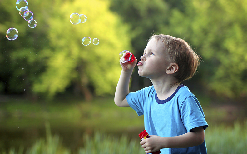 Child Blowing Bubbles