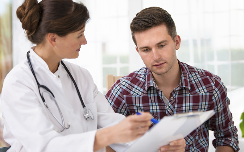 doctor consulting with concussion patient