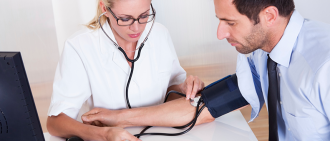 nurse checks blood pressure