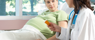 pregnant in hospital bed