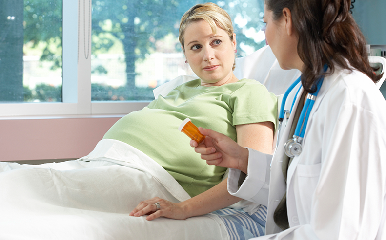 pregnant in hospital bed