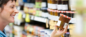 woman reading food label