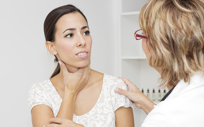 woman with sore throat