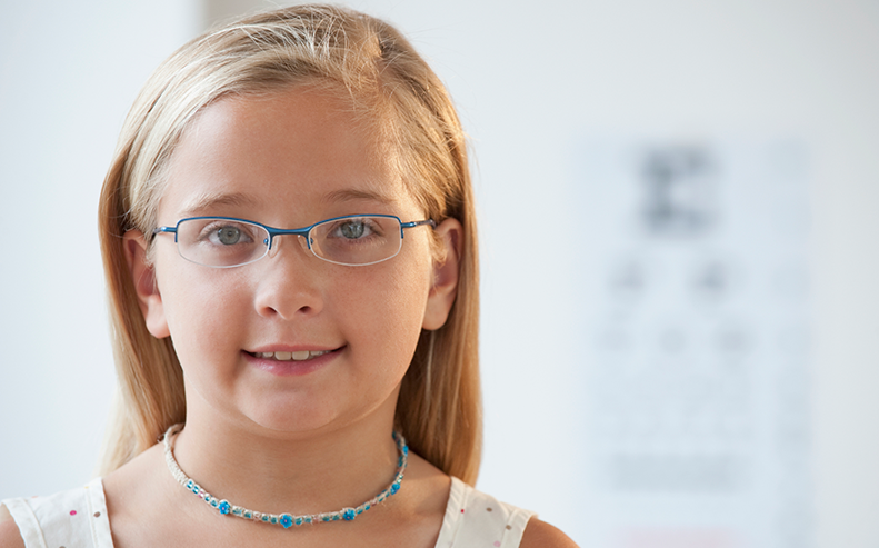 young girl wearing glasses