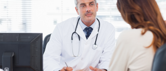 doctor talking to female patient