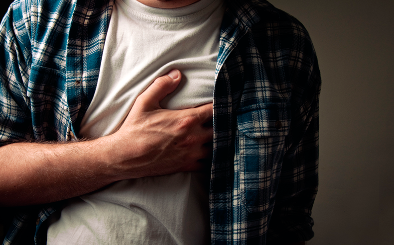 man grabbing chest
