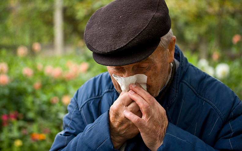 elderly man coughing