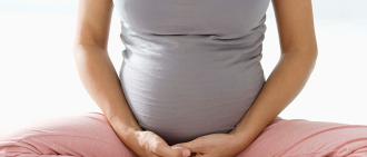 pregnant woman with legs crossed