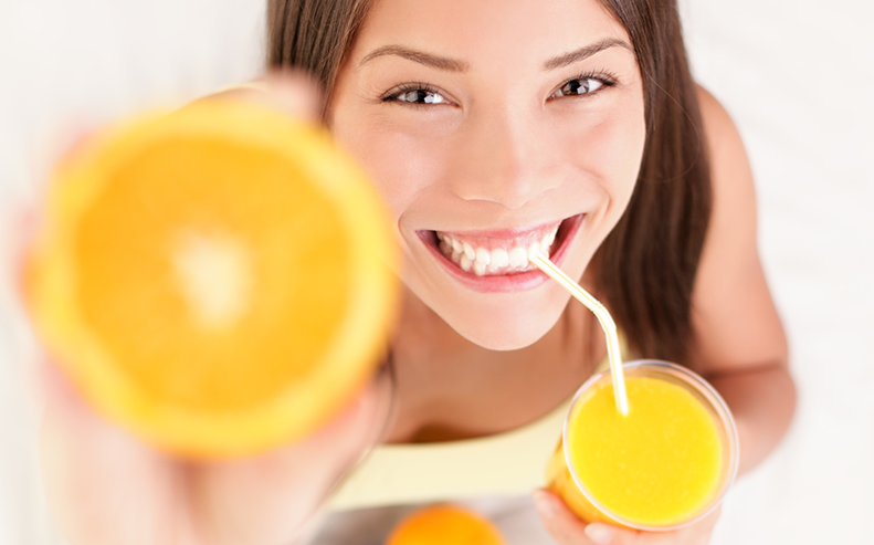 woman with oranges