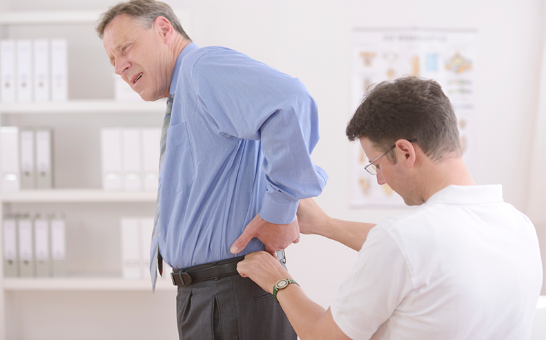 older man with back pain