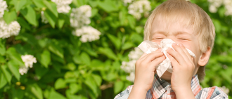 boy sneezing