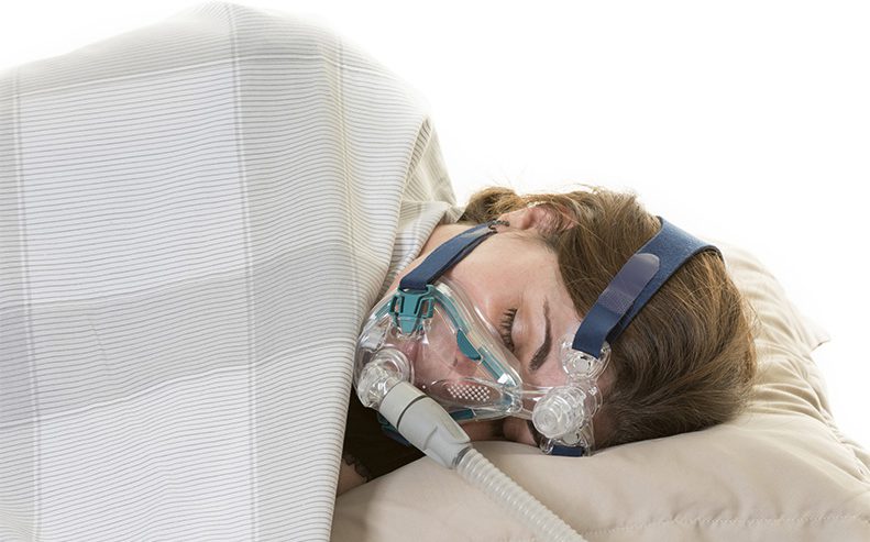 woman sleeping machine