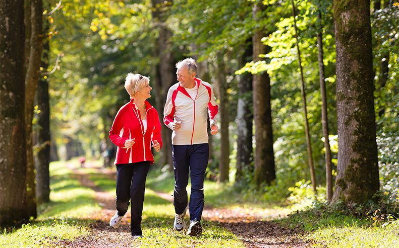 Couple Running in Woods