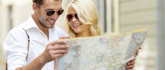 couple holding map