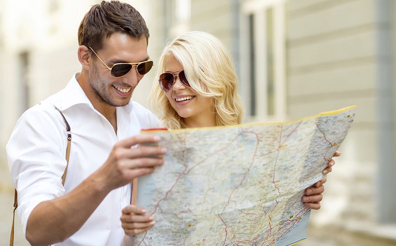 couple holding map
