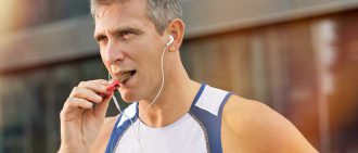 man eating energy bar