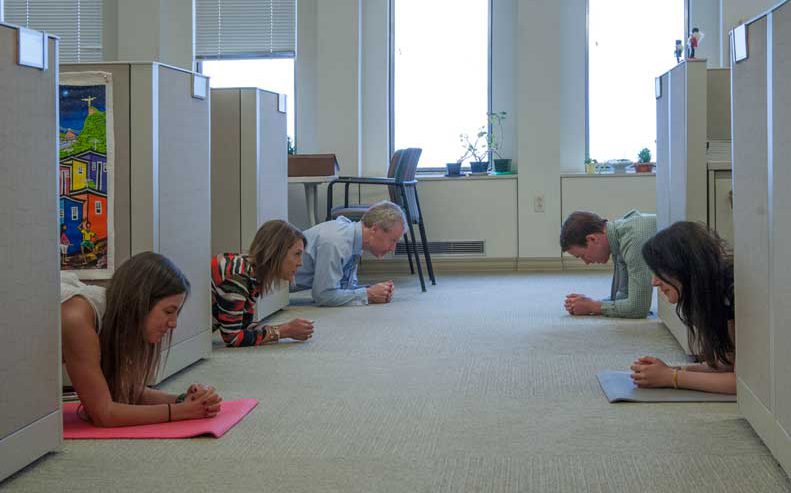 Members of the UPMC marketing department do the plank challenge