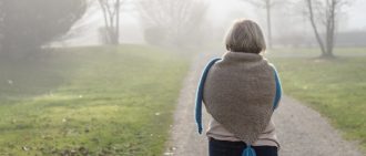 Back view of an older lady on road