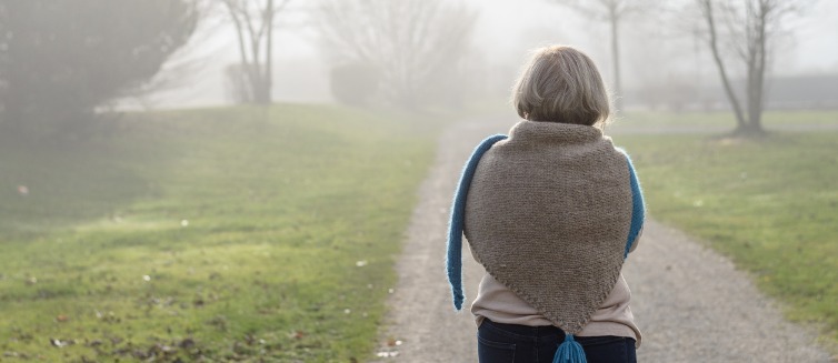 Back view of an older lady on road