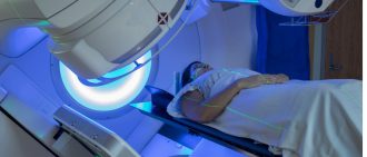 Woman getting external beam radiation