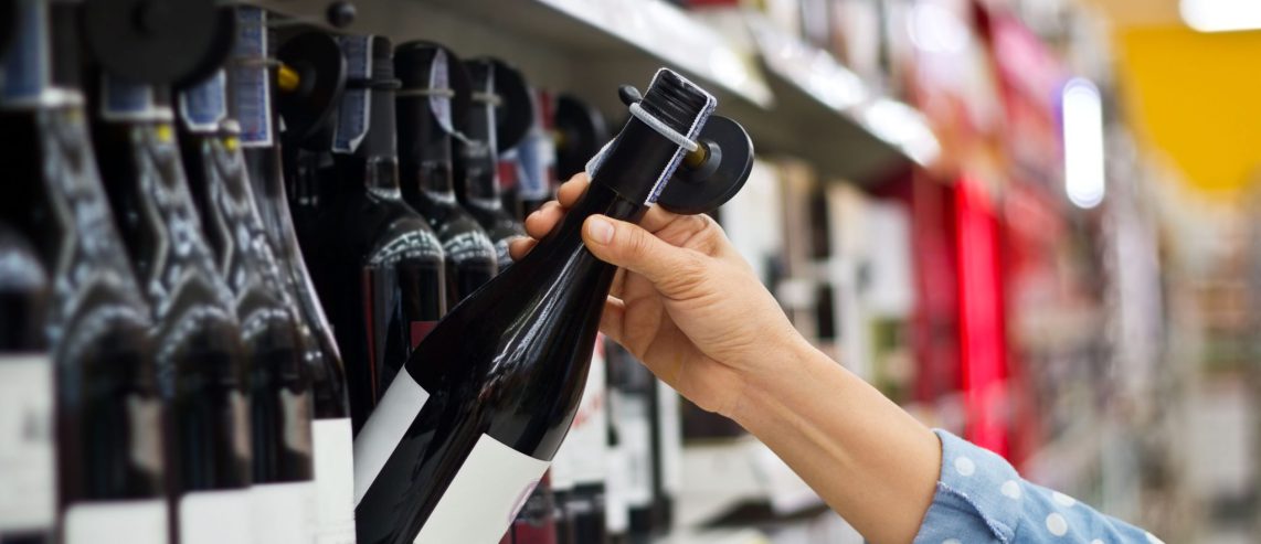 A person pulls down a beer tap to pour.
