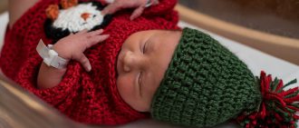 View UPMC Magee-Womens Hospital newborns wear ugly Christmas sweaters