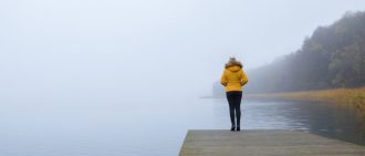 Woman on dock looking out at water