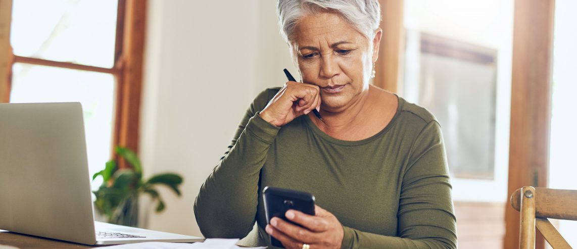 Older woman looking at phone