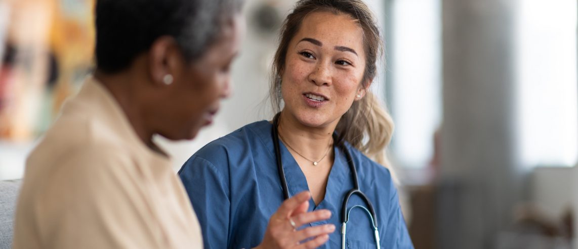 doctor and elderly cancer patient