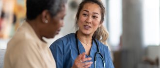 doctor and elderly cancer patient