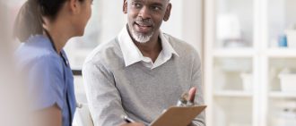 Man talking with doctor.
