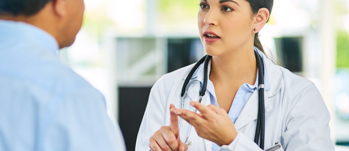 Male patient consulting doctor