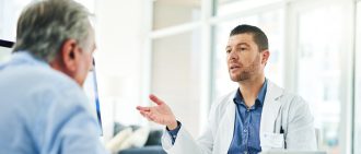 Man talking with doctor