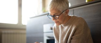older woman on tablet
