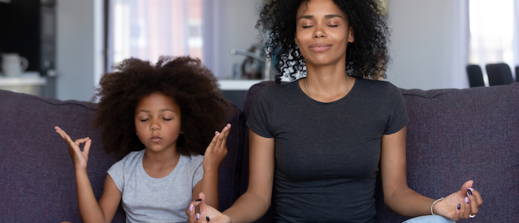 Child and mom meditating