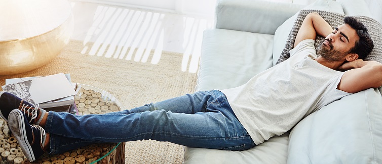 man relaxing on the sofa