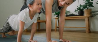 Mother and daughter doing yoga
