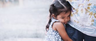 little girl hugging her mother