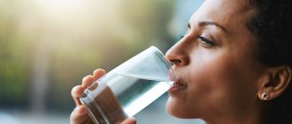 woman drinking a glass of water