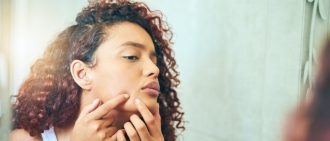 Is popping pimples bad?